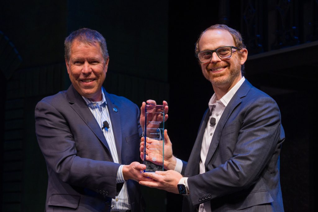 Scott Simmons (L) presents Patrick Cozzi (R) with the inaugural OGC Global Impact Award